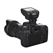 An image of the Elinchrom Skyport Pro Transmitter attached to a camera.