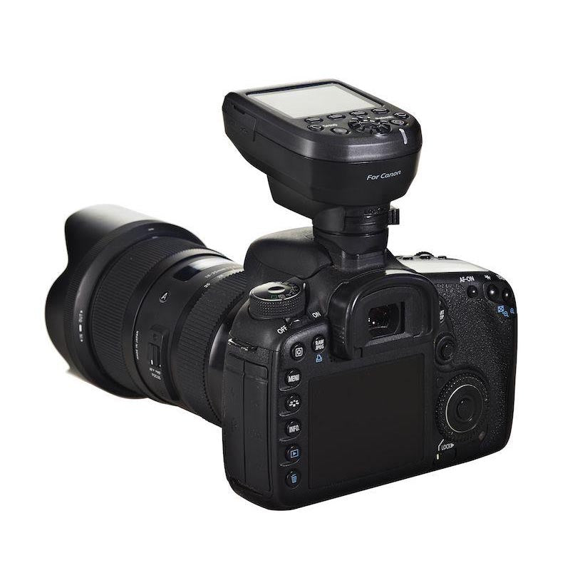 An image of the Elinchrom Skyport Pro Transmitter attached to a camera.