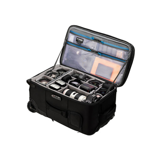 An image of the Tenba Roadie Roller 24 Black roll along case for storing cameras and photographic equipment. It is open showing a padded inset wih sections for holding cameras, lenses and other accessories and multiple pockets for storing cables, power accessories and notes.