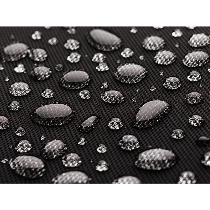 An image of the nylon fabric for the Tenba Roadie Roller 24 Black roll repelling droplets of water.