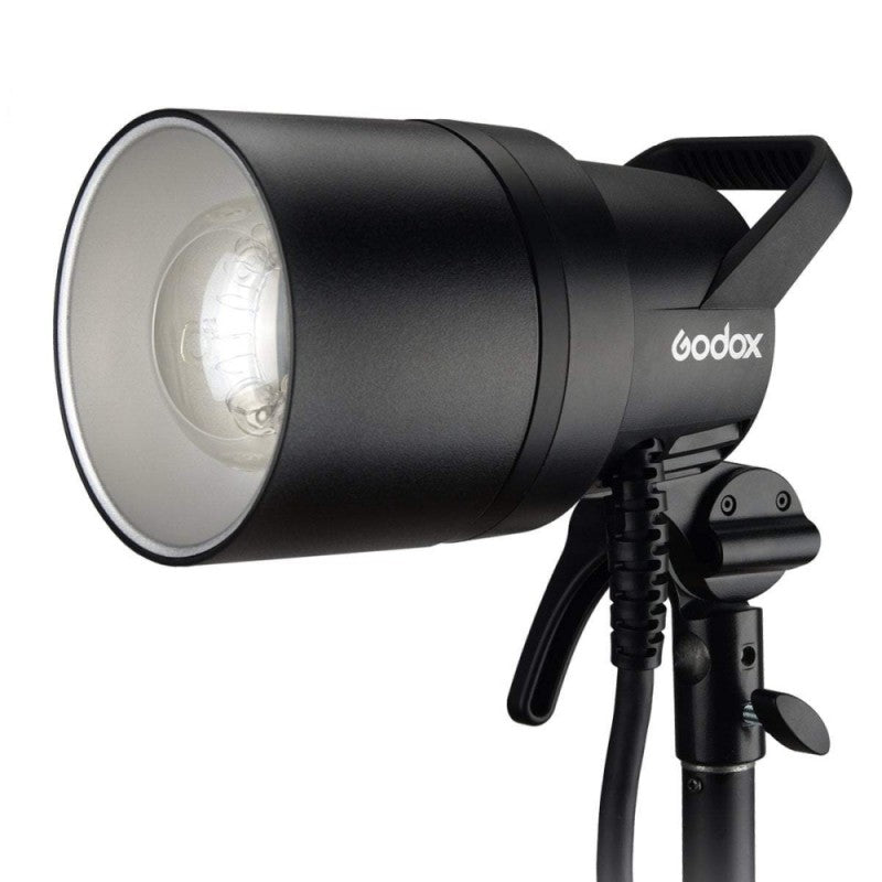 An image of the Godox AD1200Pro TTL Battery Studio Flash Light. The light features a handle on the back for portability and is pictured mounted on a light stand.